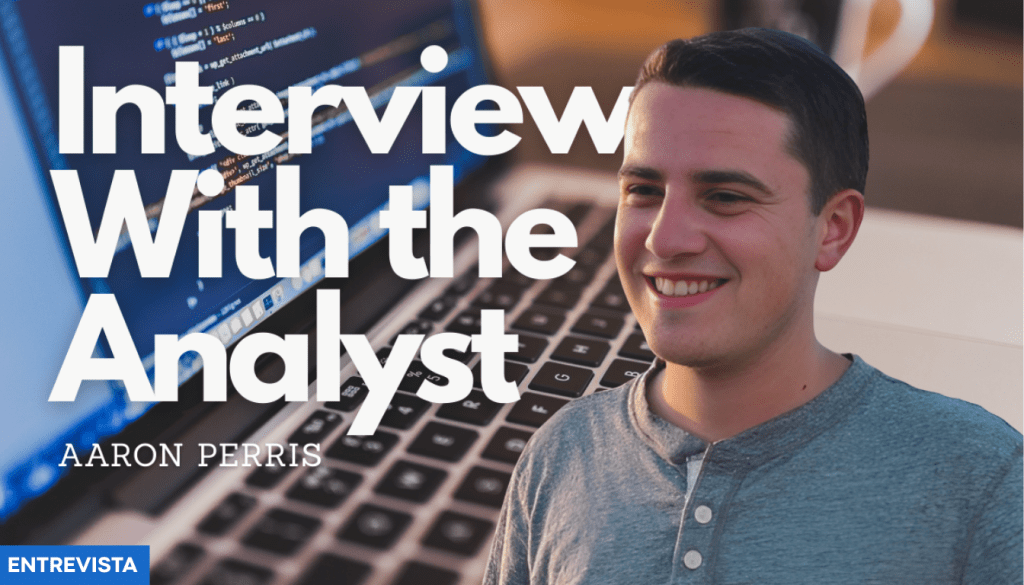 A young man named Aaron Perris is smiling in front of a laptop, with programming code visible on the screen. The text overlay reads 'Interview With the Analyst'.