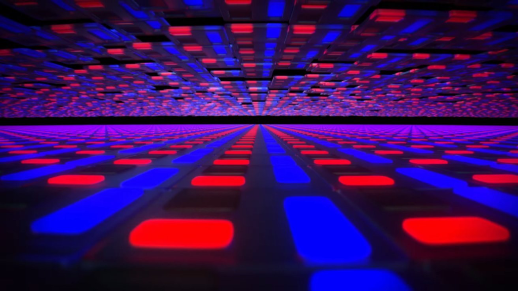 Una imagen abstracta que muestra una superficie compuesta por patrones en tonos rojos y azules, creando un efecto de profundidad y perspectiva.